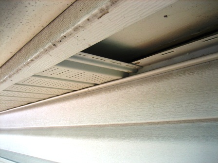 Image of vinyl soffits installed over wood soffits.